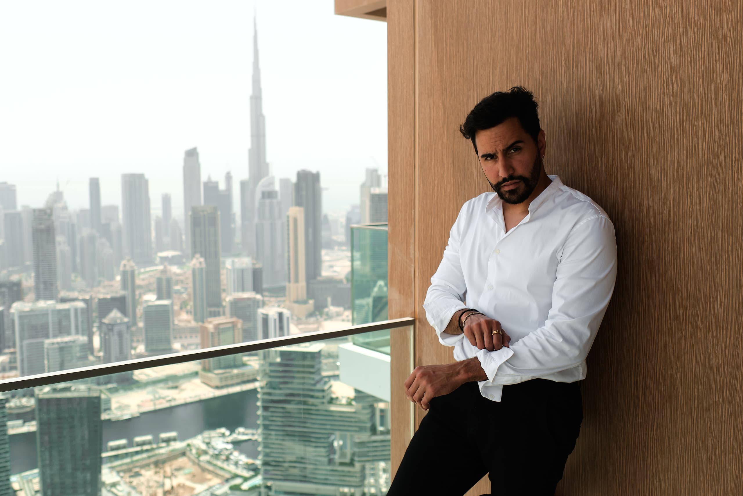 Brookz Lab founder working from a balcony overlooking the city